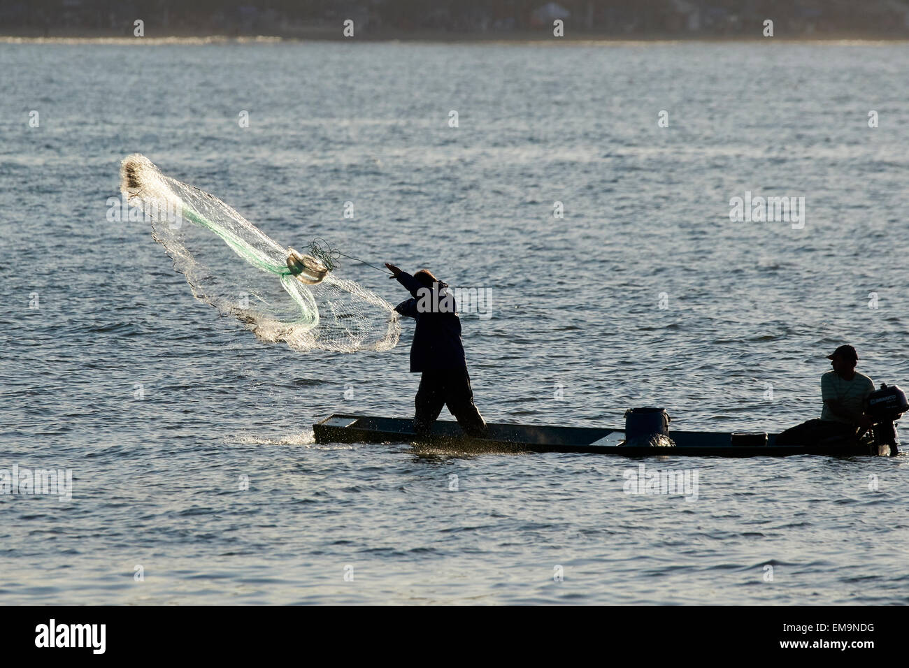 Fishing with a throw net Stock Photo Alamy