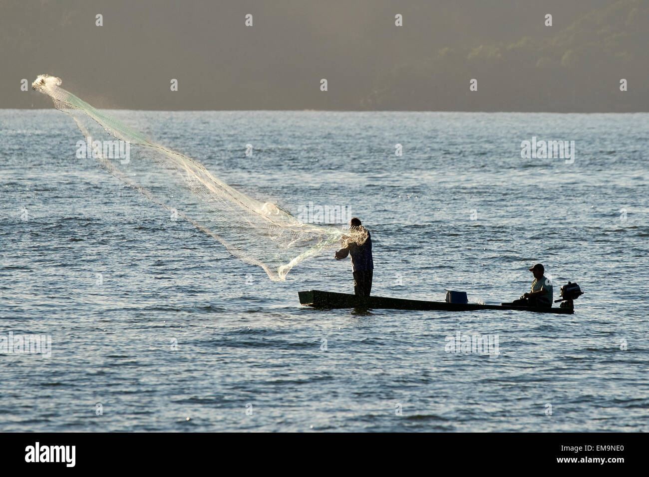 Fishing with a throw net Stock Photo - Alamy