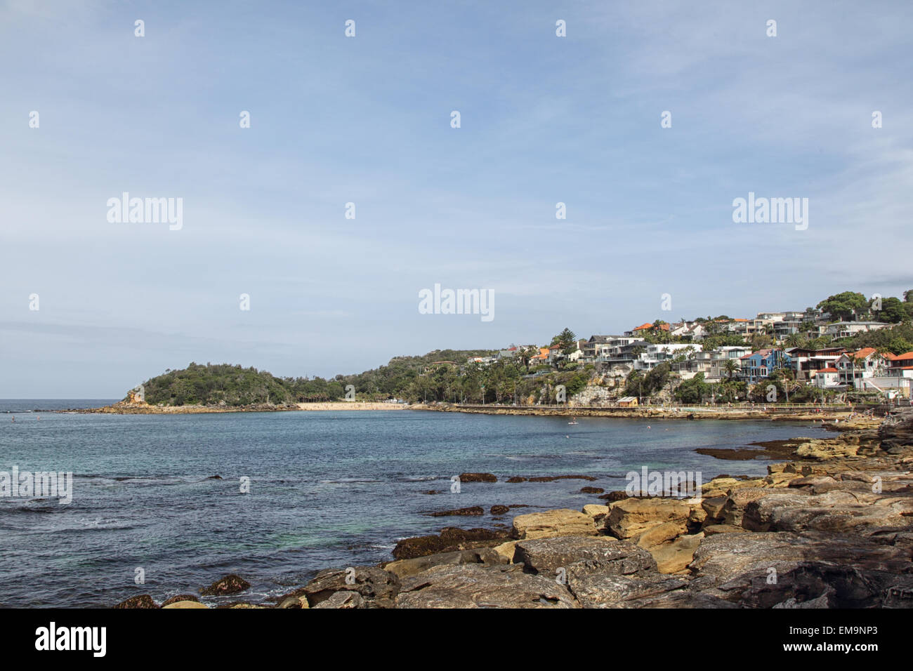 Rocky coast at the Cabbage Tree Bay and view towards Shelly Beach in