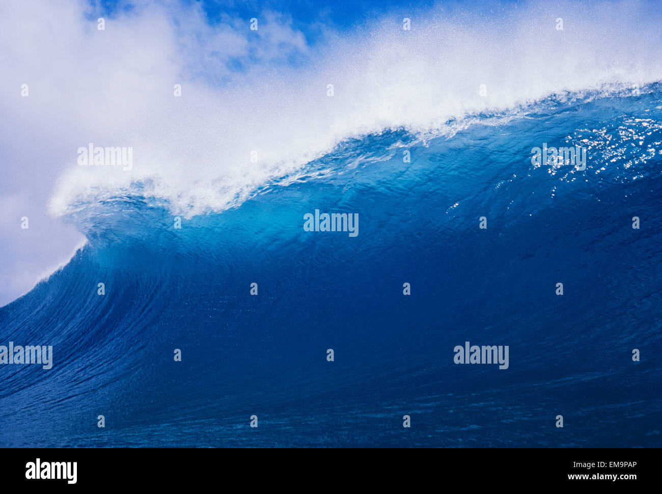 Blue Wave Curling Over Forming Barrel With White Waters. Stock Photo