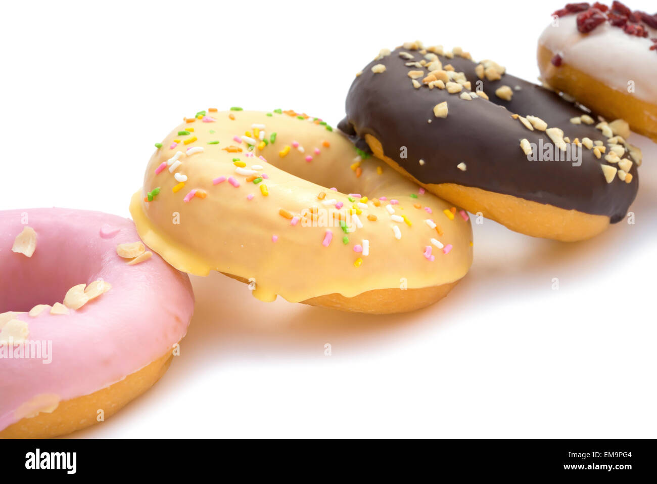 colorful donuts on a white background with clipping path Stock Photo ...