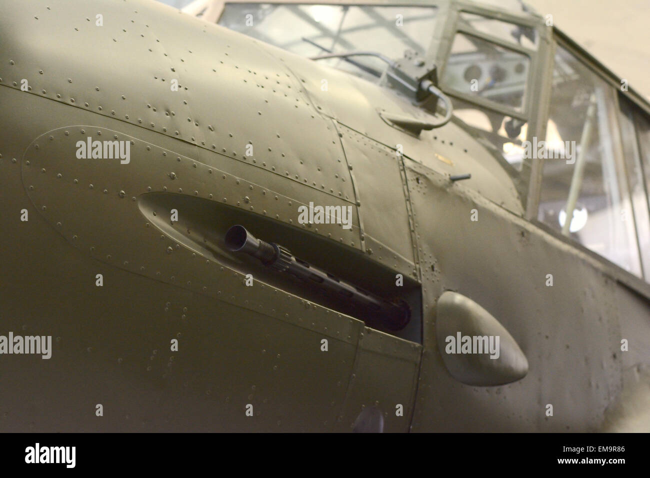 cockpit and machine gun of ww2 war plane in a hanger at Imperial War Museum, Duxford Stock Photo