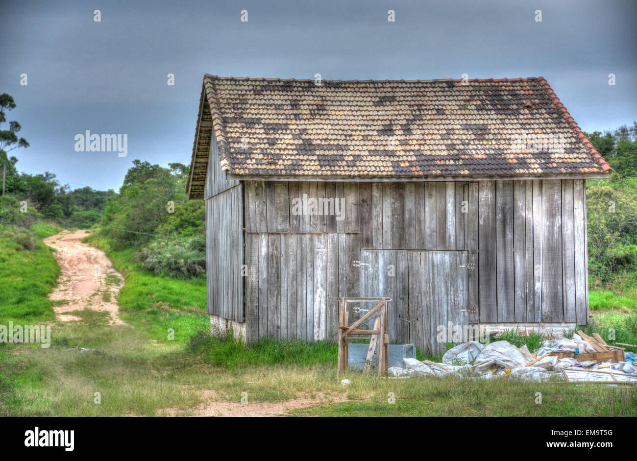 Wood shack in the middle of a farm field in the Brazilian countryside Stock Photo