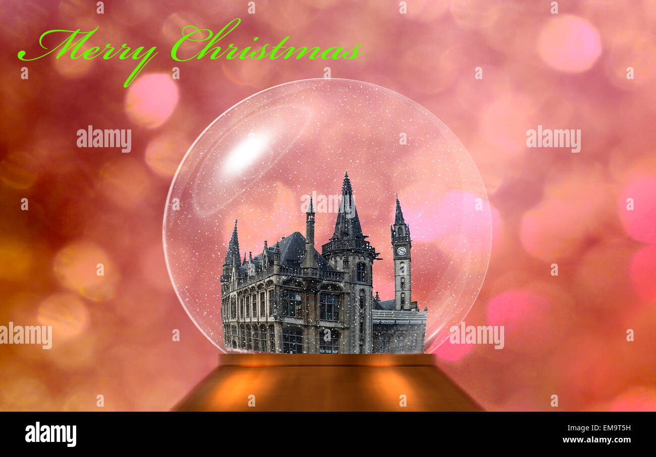Beautiful snowglobe over a christmas background and the words merry christmas Stock Photo