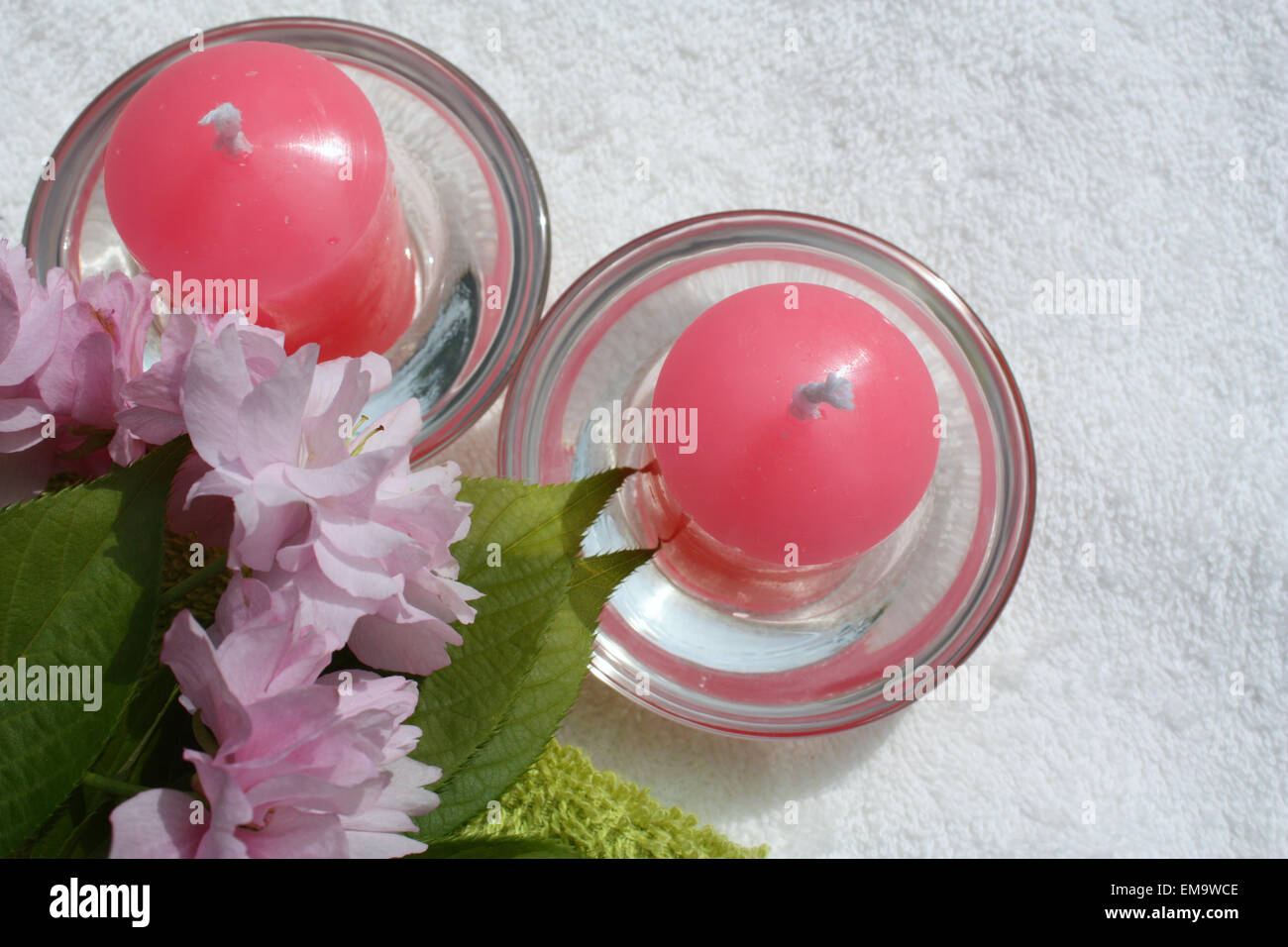 Pink cherry blossom flowers with candles Stock Photo