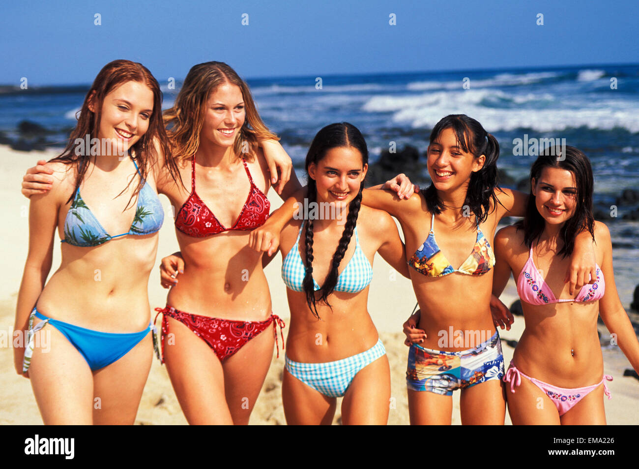 Naked girls beach photos Group Of Teenage Girls Walking Along Beach Arm Over Shoulders Stock Photo Alamy