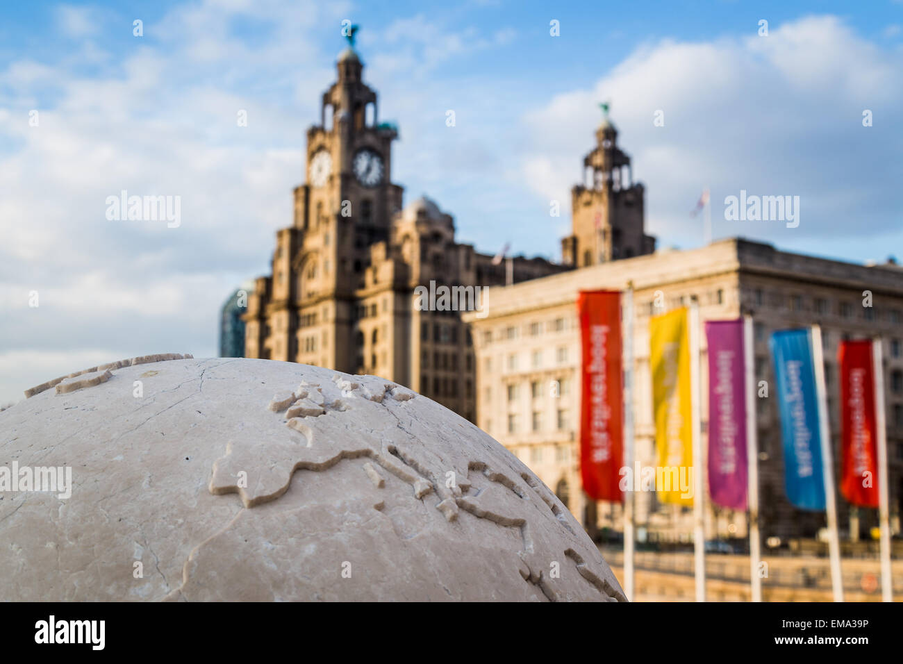 Globe statue in front of the Three Graces. Stock Photo