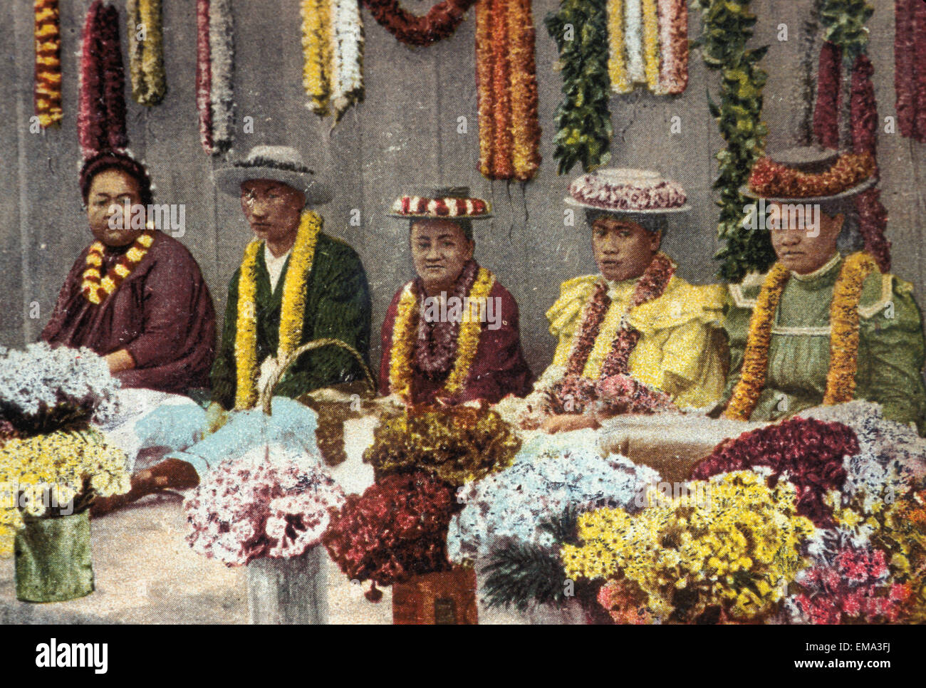 C.1900 Lei Makers Sitting In A Row Surrounded With Fresh Flowers, Close-Up, Postcard Stock Photo