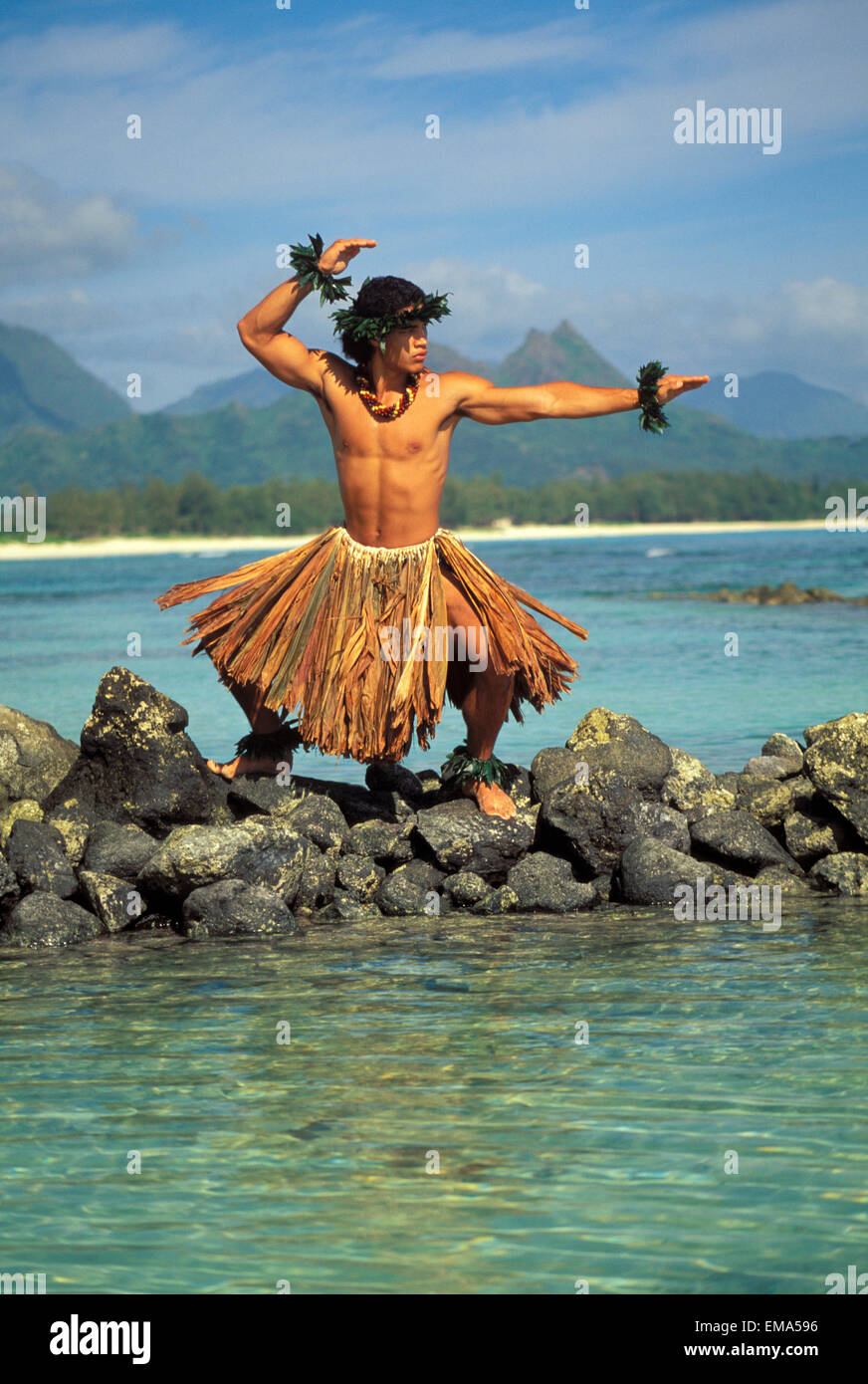 Hawaii, Kane Kahiko Hula On Reef In Bay, Posing In Traditional Dress ...