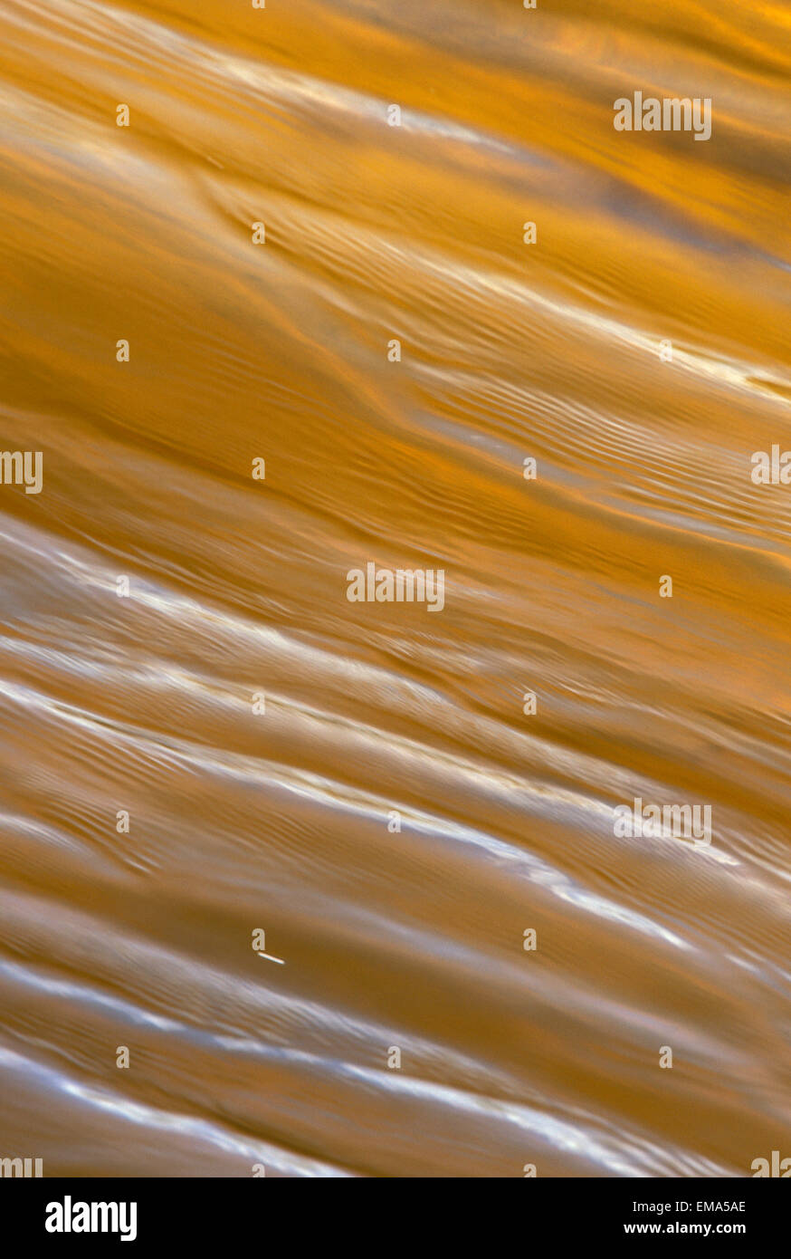 Ripple, Crinkled Surface Texture Of Golden Brown Water Stock Photo - Alamy