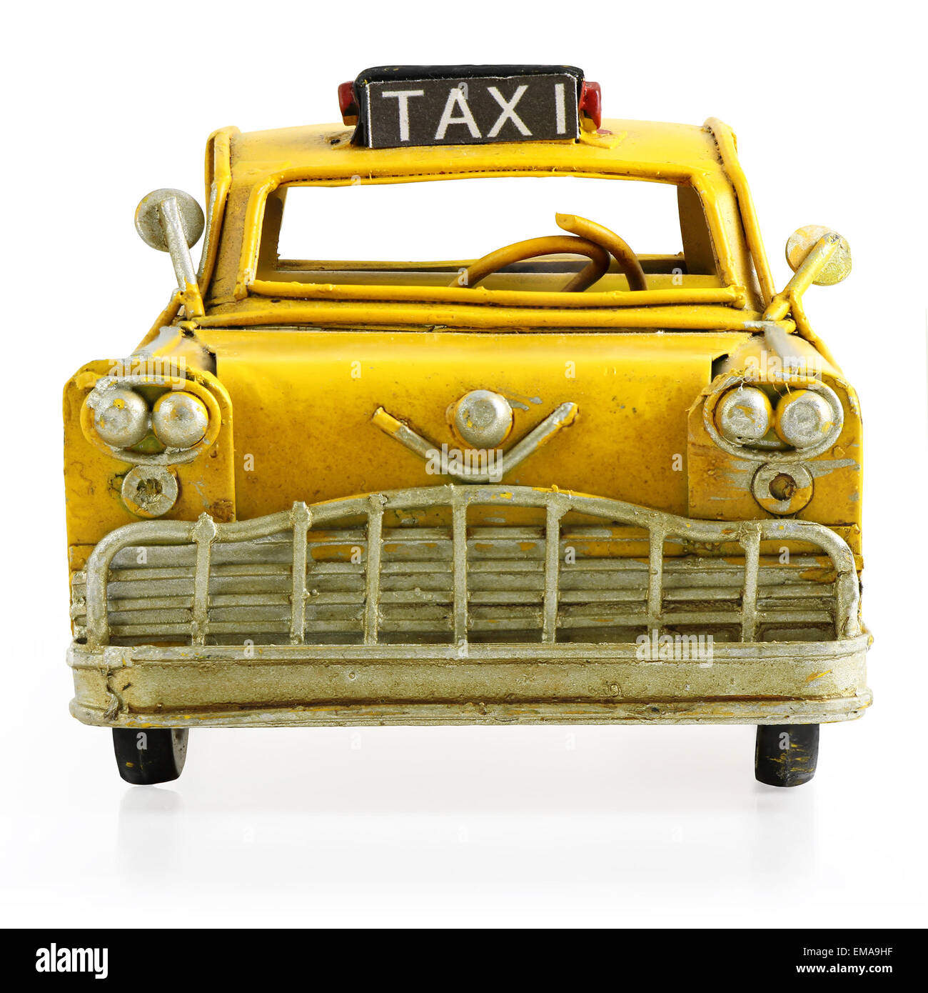 Old retro toy yellow taxi isolated on white background Stock Photo