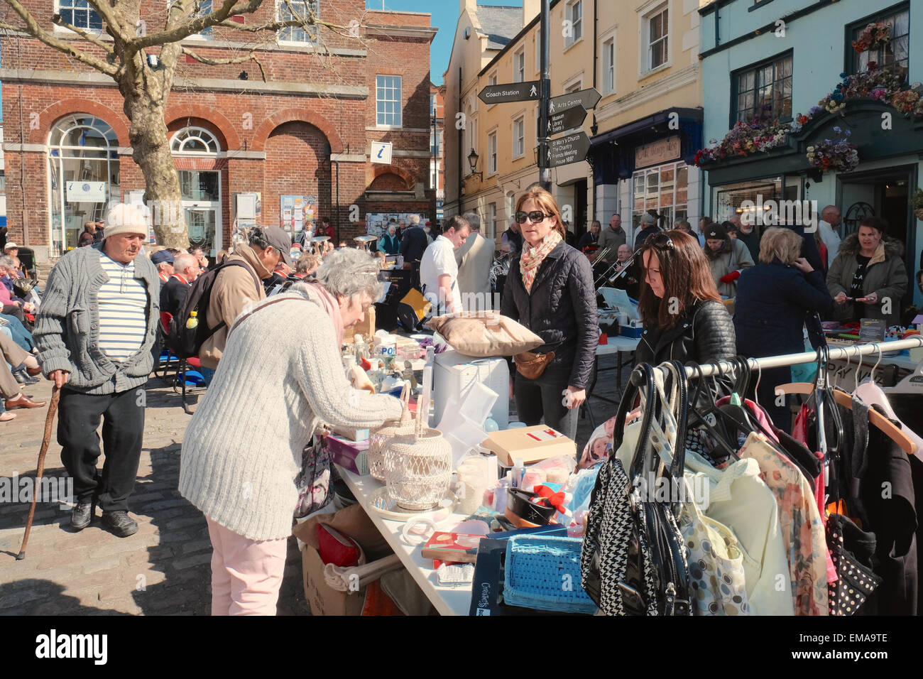 Bridport, Dorset, UK. 18th April, 2015.  Crowds enjoy the sunshine in Bucky Doo square during  Bridport's Saturday market the week that the town topped a list in the Times Newspaper of the happiest towns in Britain. Credit:  Tom Corban/Alamy Live News Stock Photo