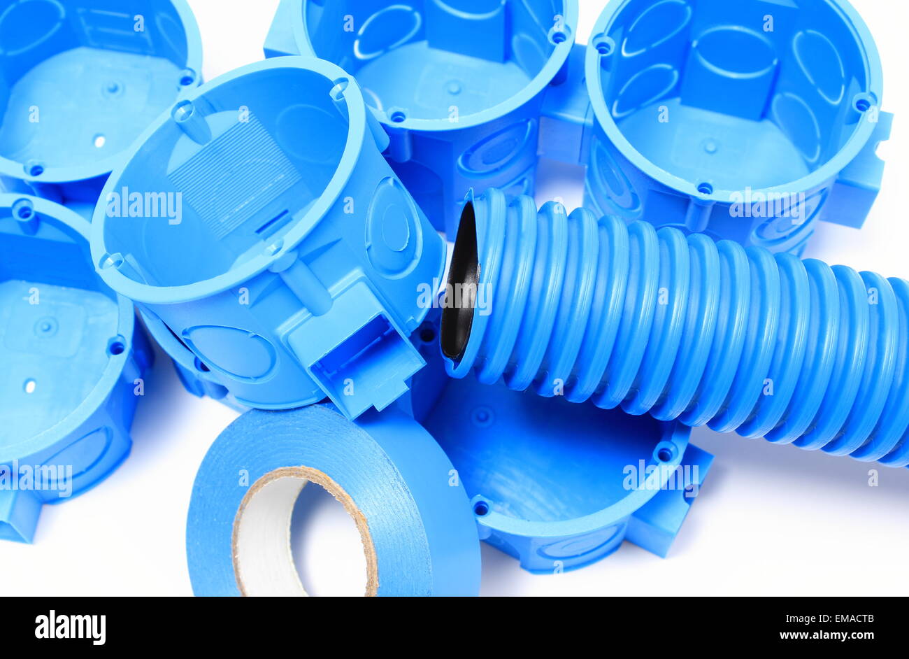 Heap of blue electrical boxes and components for use in electrical