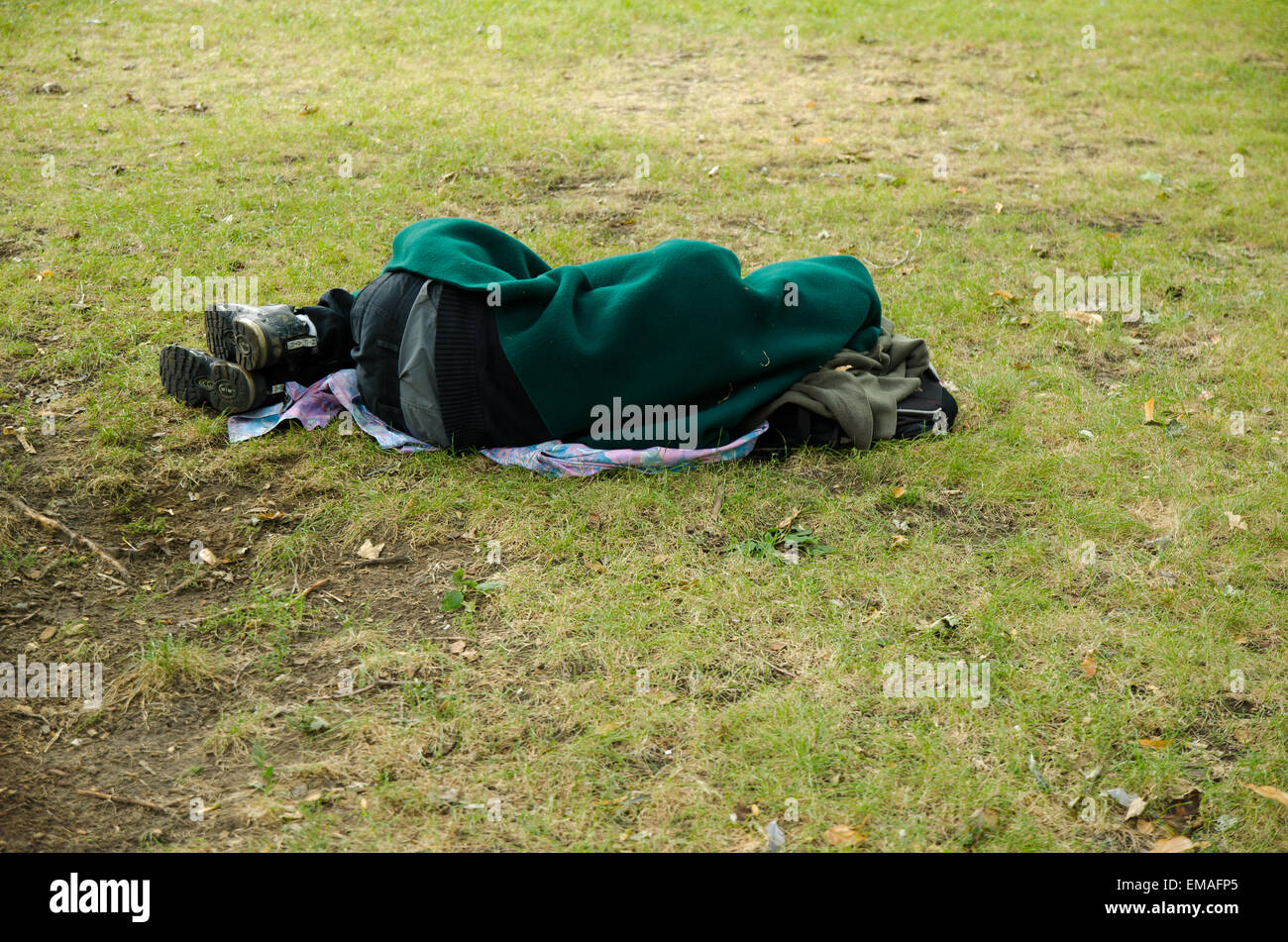 A homeless man sleeping in a Montreal Park Stock Photo - Alamy