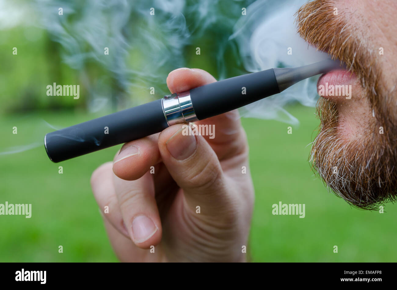 Close-up of a man vaping an electronic cigarette Stock Photo