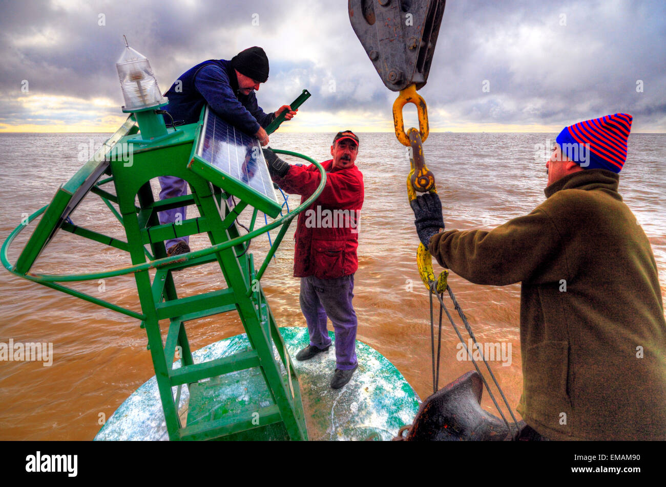 Working on board at beaconing ship at Demarchi Island Port, River Plate ...