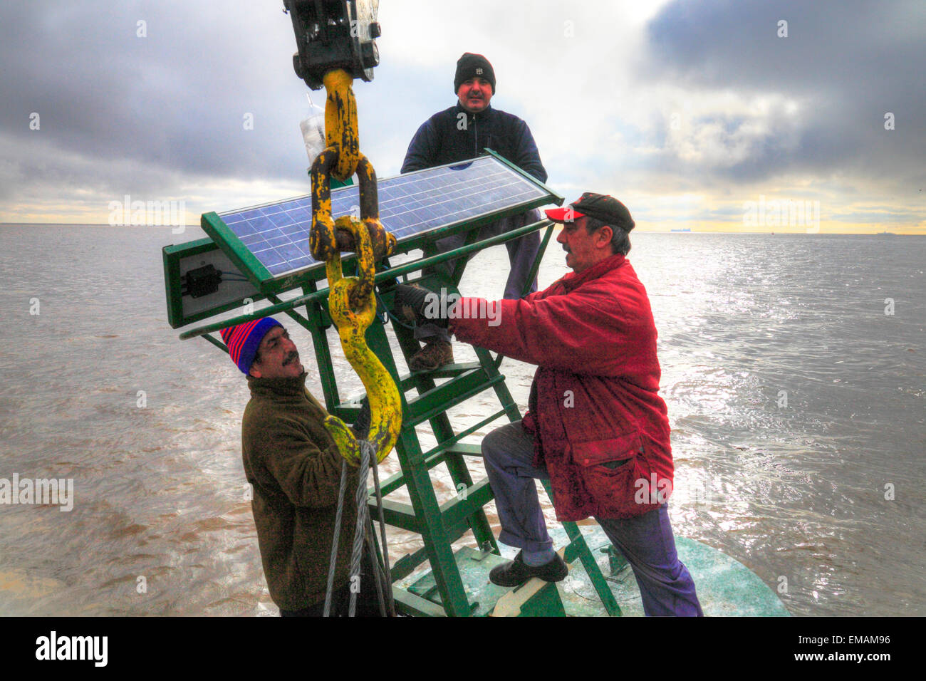 Working on board at beaconing ship at Demarchi Island Port, River Plate ...