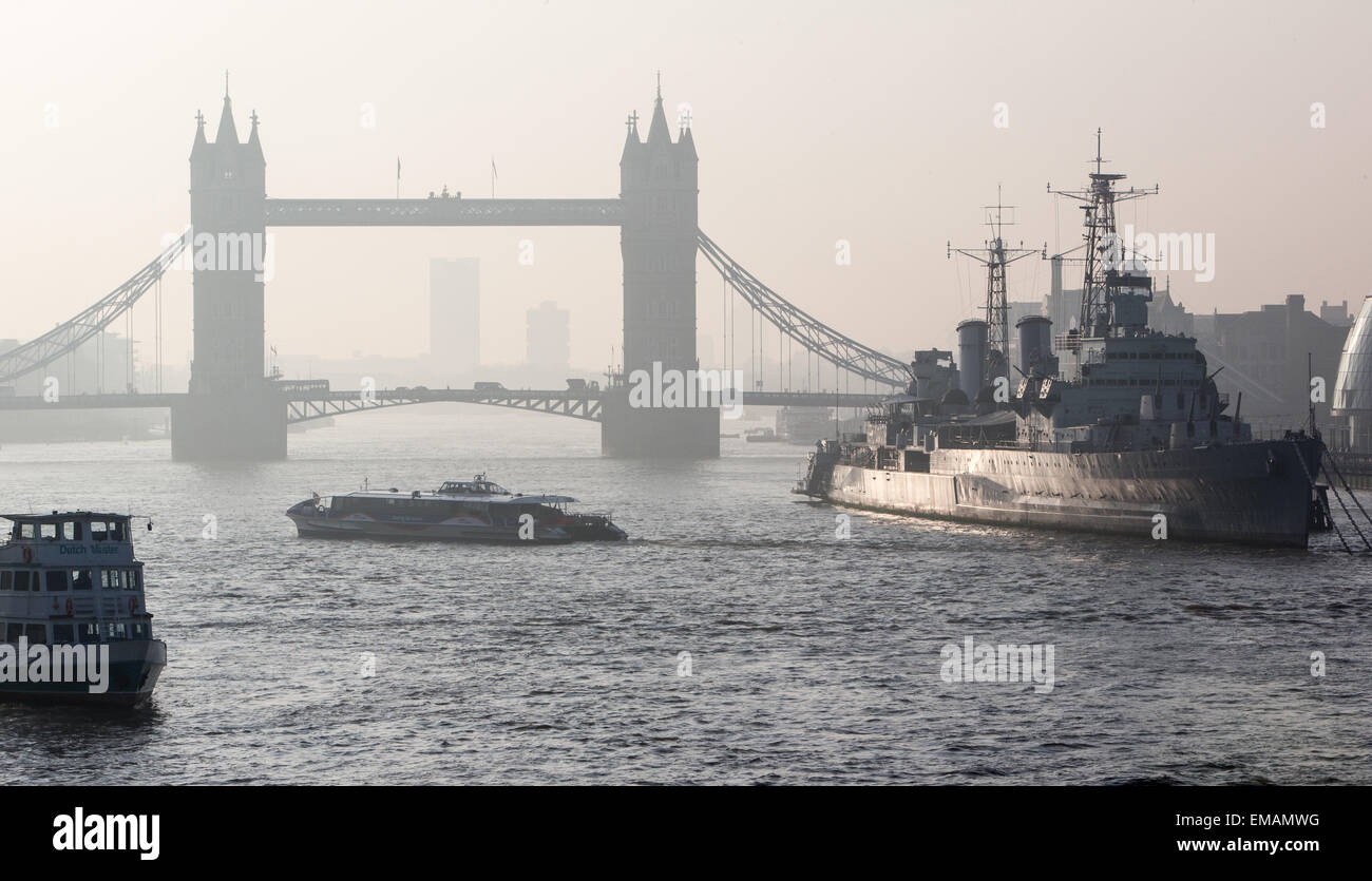 Heavy smog lies in the morning air with an easterly view of Tower Bridge in London showing pollution from carbon emissions Stock Photo