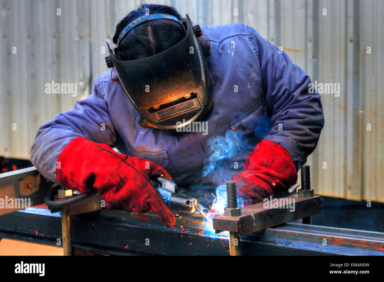 Welding workers at Demarchi Island Port, River Plate  Coast. Buenos Aires, Argentina Stock Photo