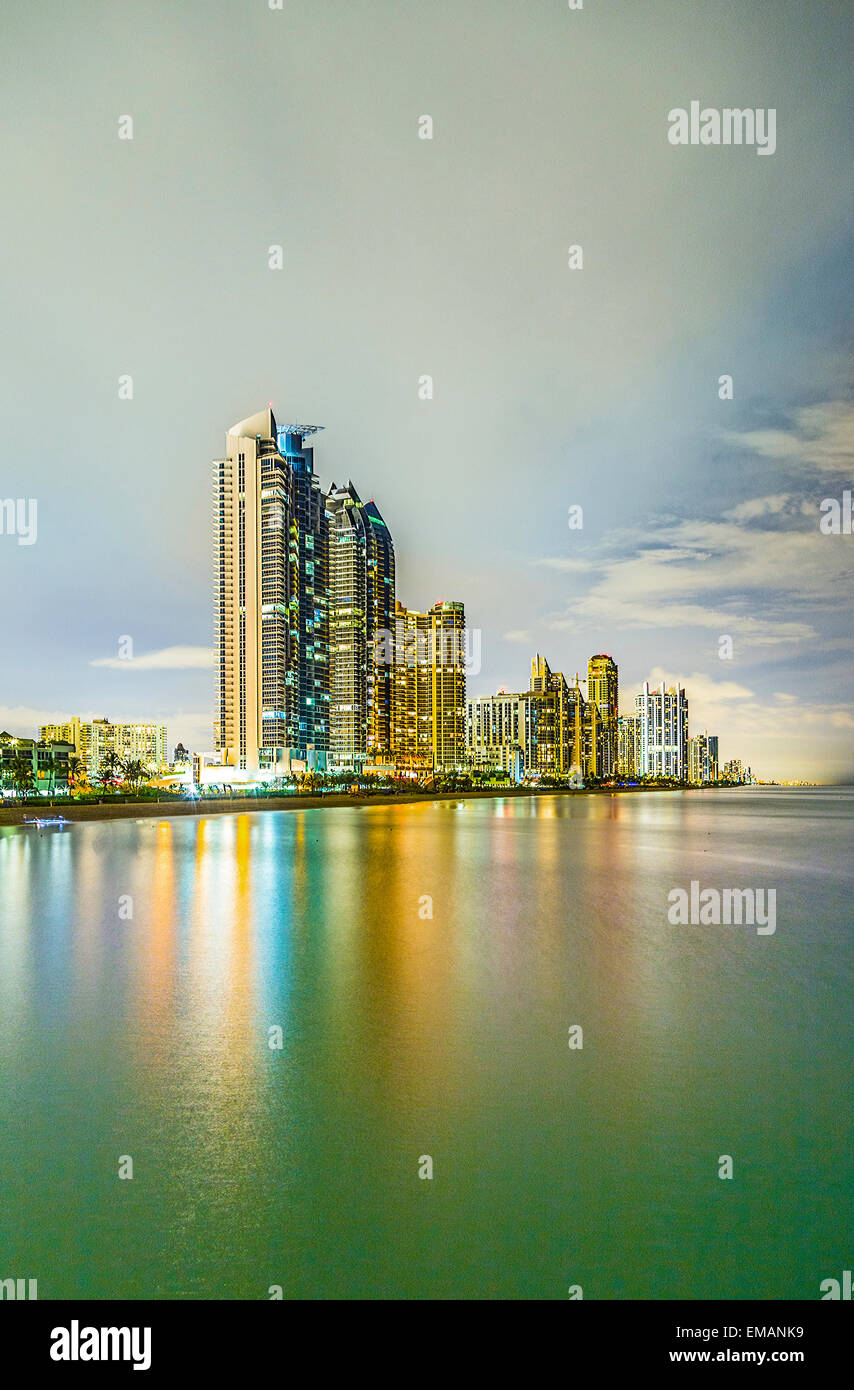 skyline of sunny isles beach by night with reflection in the ocean Stock Photo