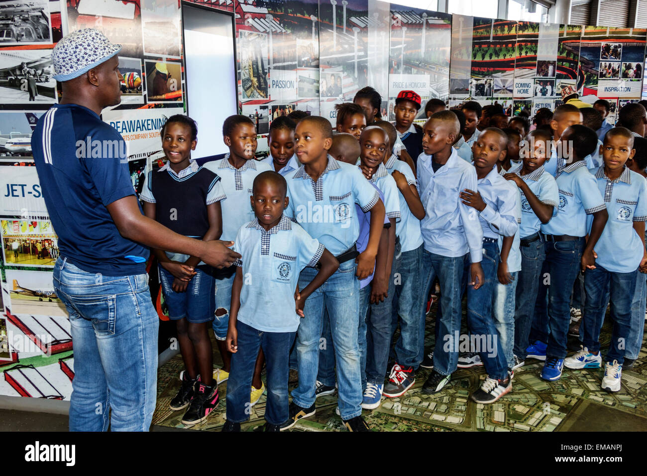 Johannesburg South Africa,O. R. Tambo International Airport,terminal,gate,class field trip,Black male boy boys kids children girl girls,female youngst Stock Photo