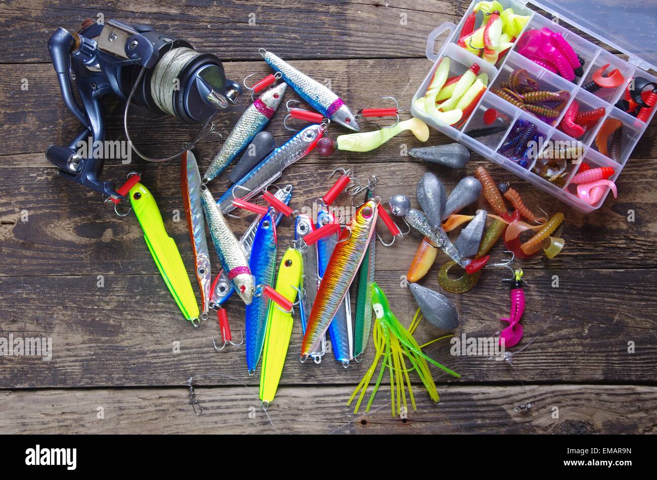 metal angling bait and reel on white background Stock Photo