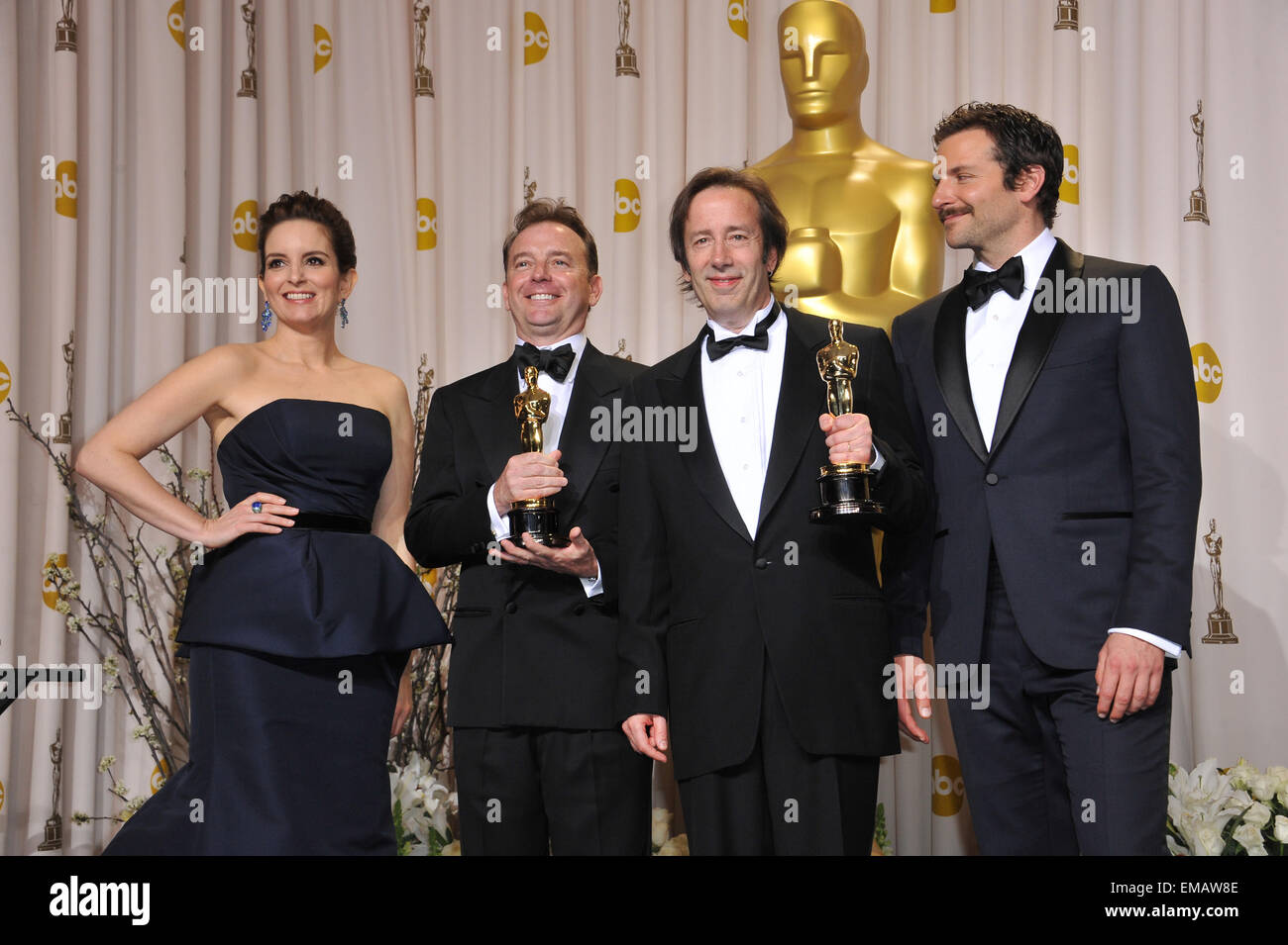 LOS ANGELES, CA - FEBRUARY 26, 2012: Philip Stockton & Eugene Gearty, winners for Best Sound Editing for Hugo, with presenters Tina Fey & Bradley Cooper at the 82nd Academy Awards at the Hollywood & Highland Theatre, Hollywood. Stock Photo