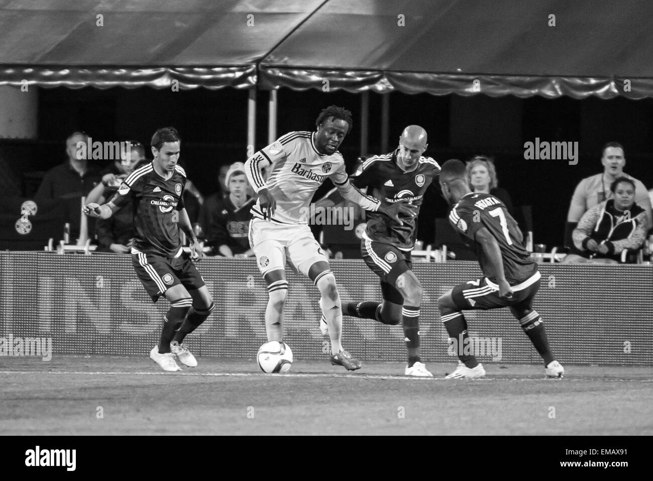 Columbus, Ohio, USA. 18th April, 2015. Columbus Crew SC forward Kei Kamara (23) surrounded by Orlando City SC players during the match between Orlando City SC and Columbus Crew SC at MAPFRE Stadium, in Columbus OH. on April 18, 2015. Credit:  Cal Sport Media/Alamy Live News Stock Photo