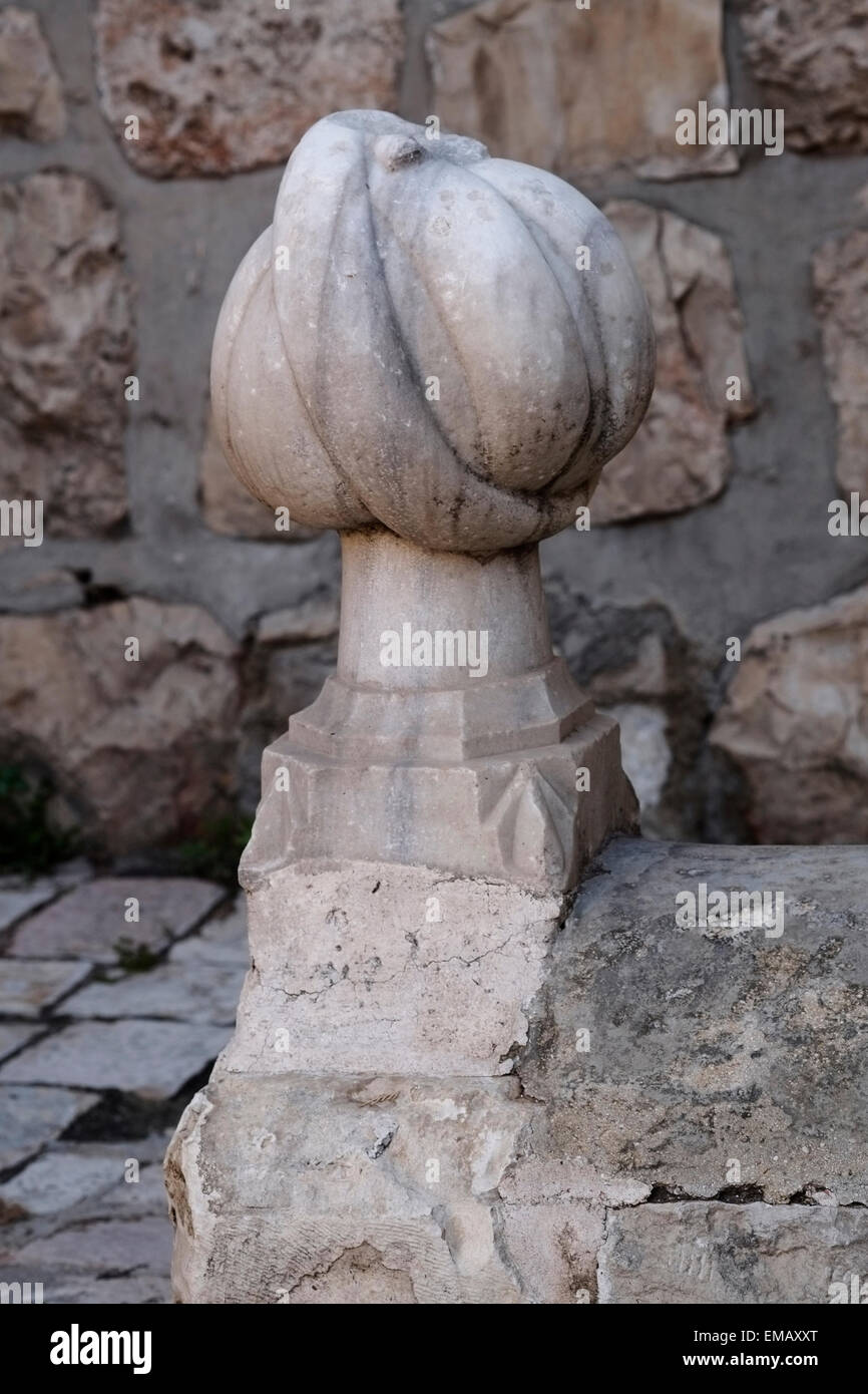 View of the Ottoman tombstone and the stone turban ornament atop it at the Ottoman engineers' burial compound near the Jaffa gate Old city East Jerusalem Israel Stock Photo
