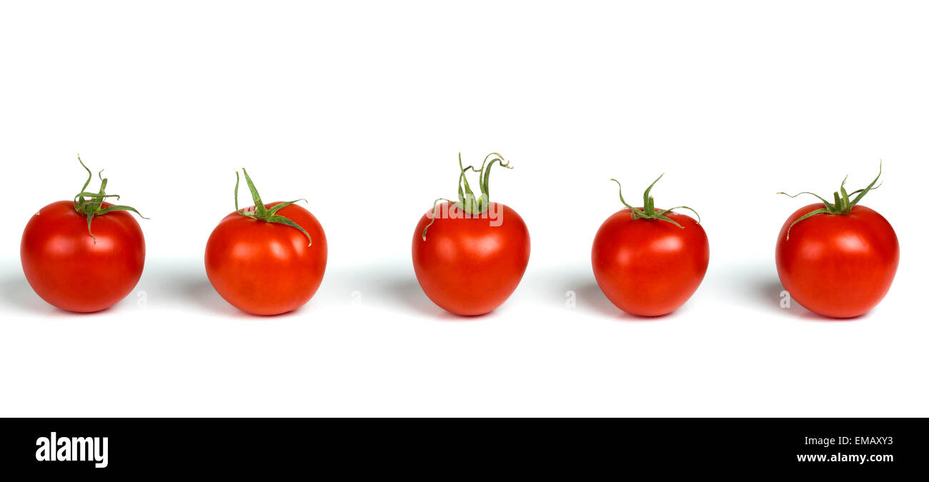Line of natural organic red cherry grape tomatoes isolated on white Stock Photo