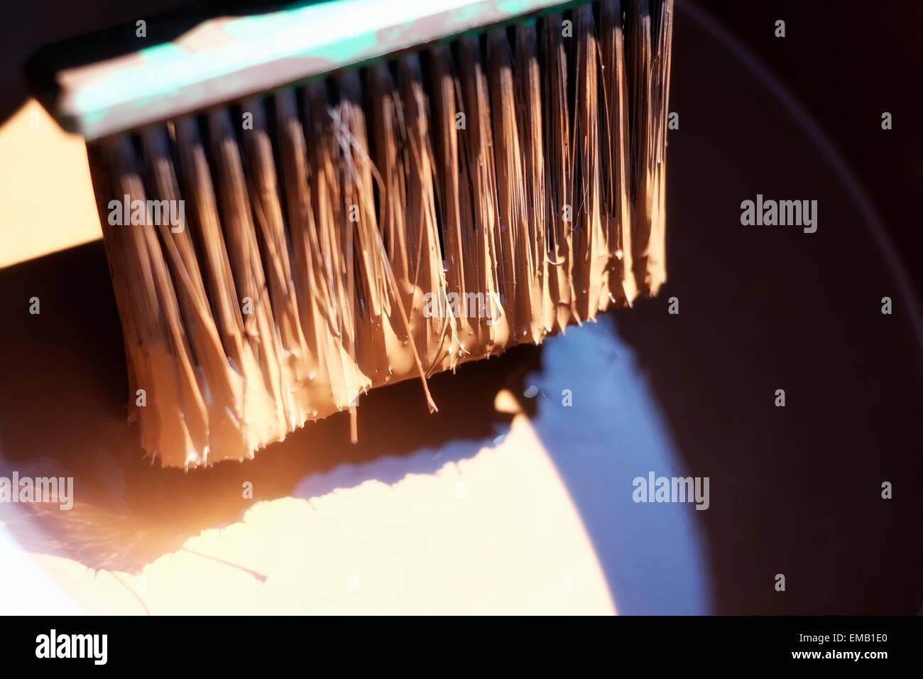 A brush loaded with fence paint. Stock Photo