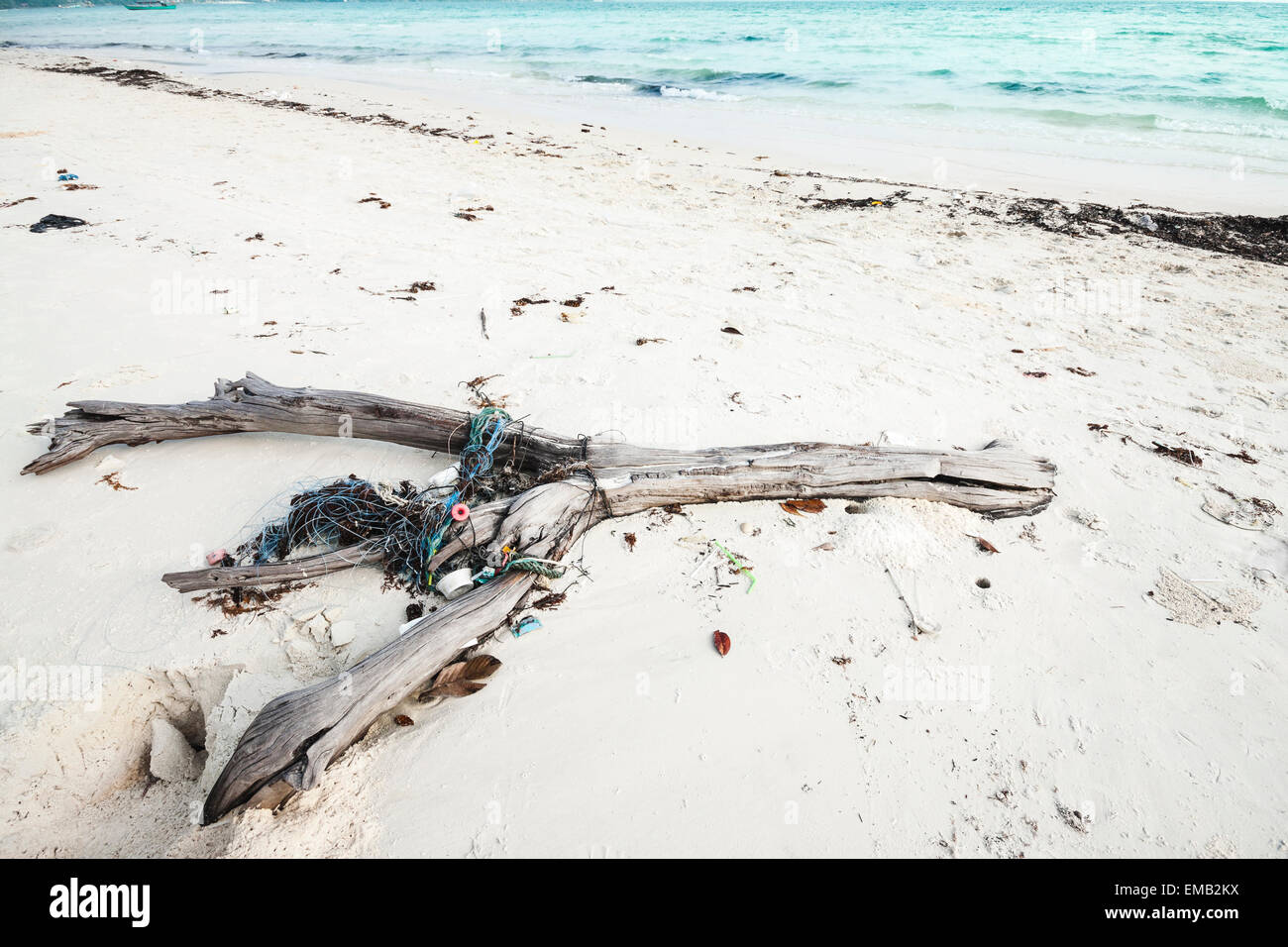 Rubbish washed up on the white sand beach in Cambodia, Asia. Stock Photo