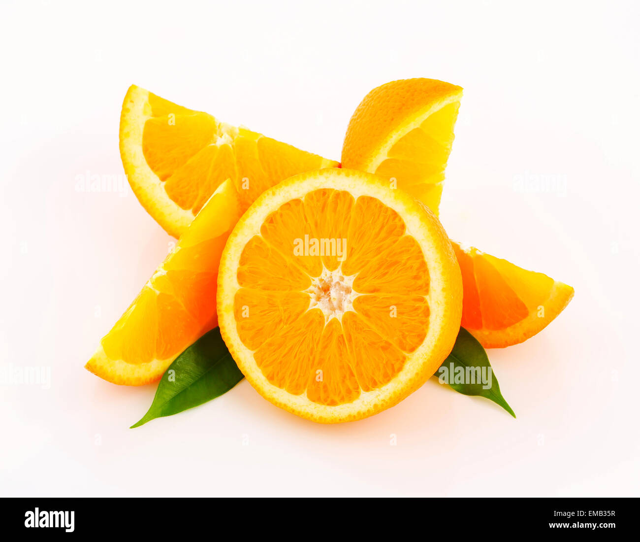 Cut orange fruit - half and wedges Stock Photo - Alamy