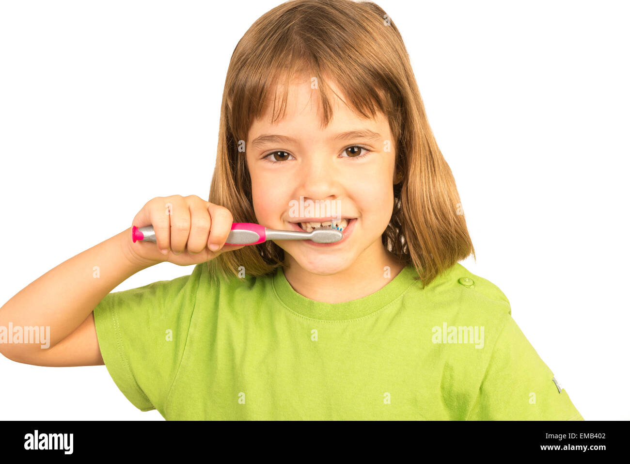 Portrait of a little girl brushing his teeth Stock Photo