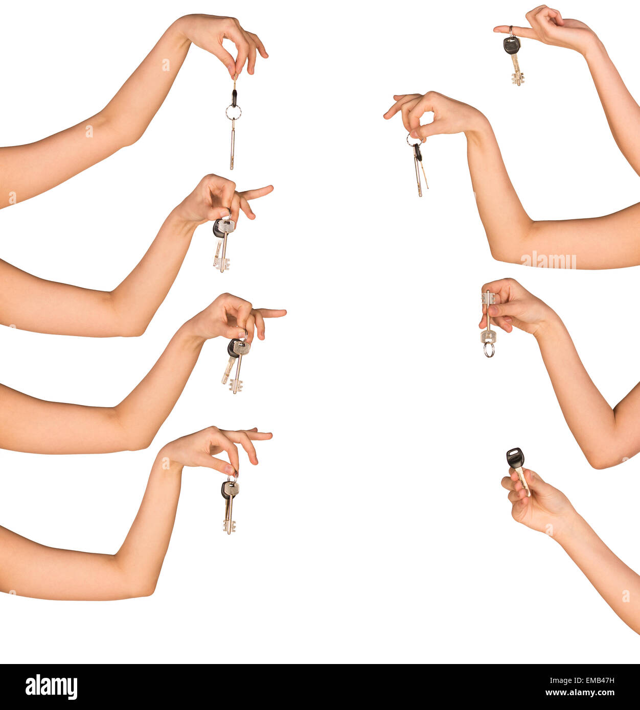 Womans hands holding house keys on white isolated background Stock Photo