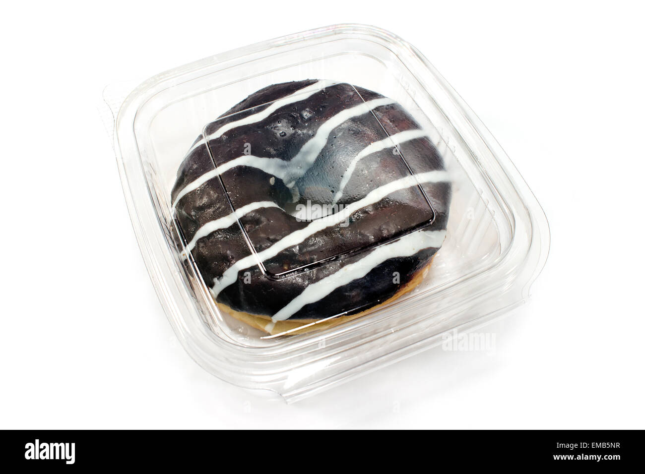 Donut in chocolate glaze in plastic box isolated on white Stock Photo