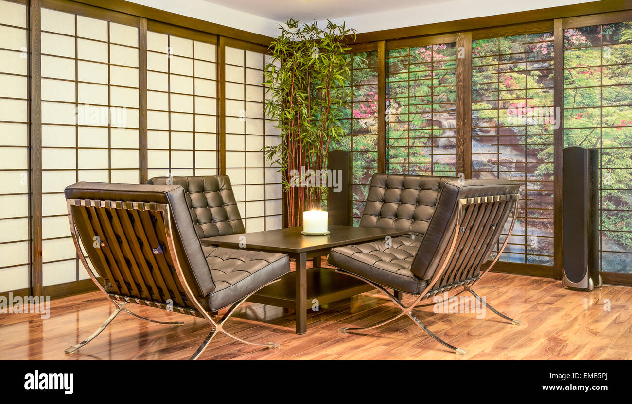 Contemporary Japanese Room with tea table, candle and four lounge chairs Stock Photo