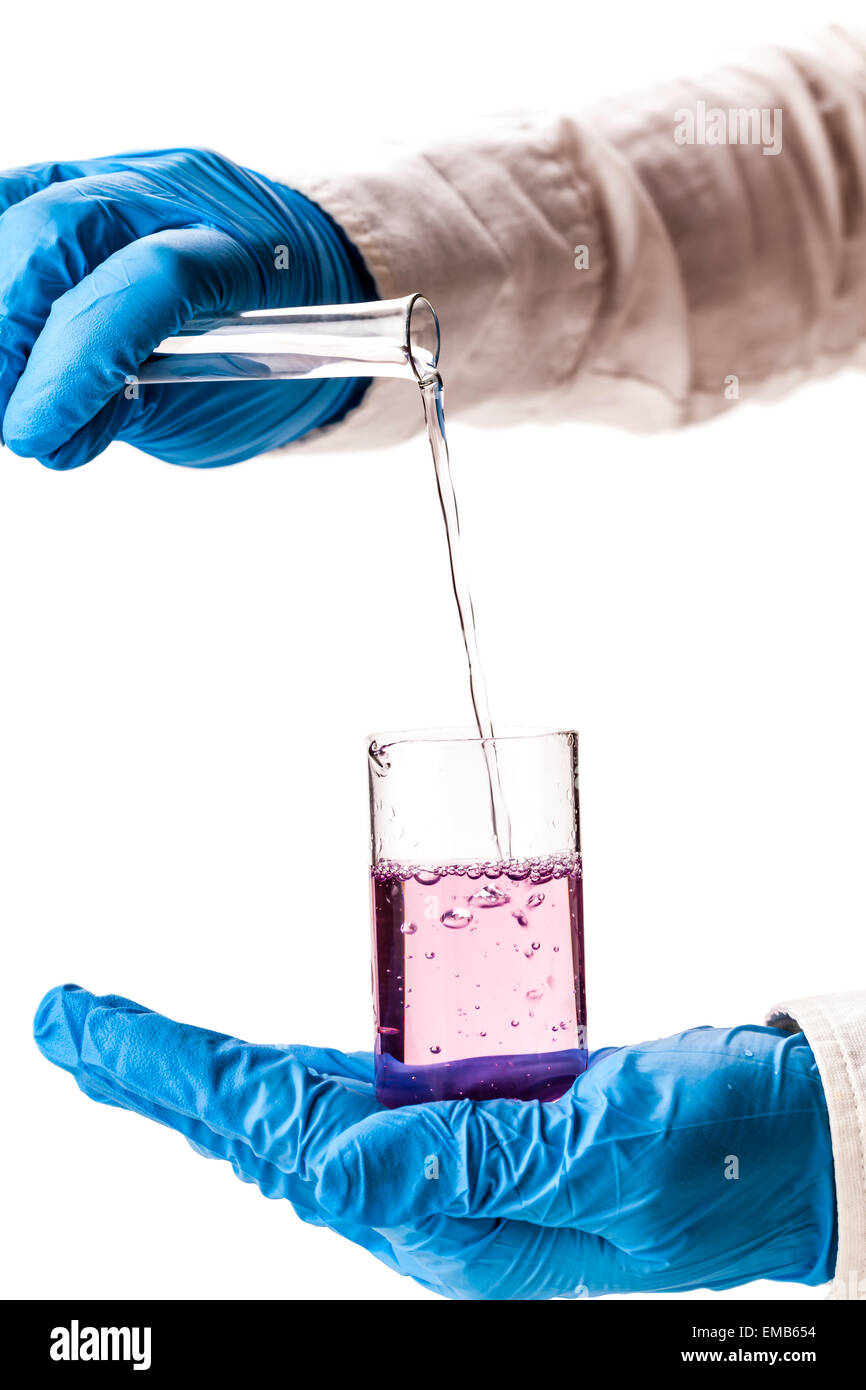 assistant reagent pouring into the flask on a white background Stock ...