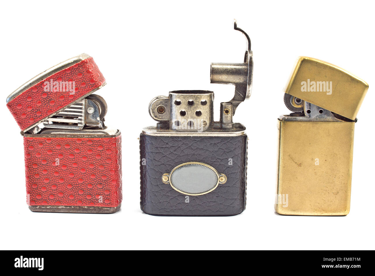 Three vintage cigarette lighters  isolated on white Stock Photo