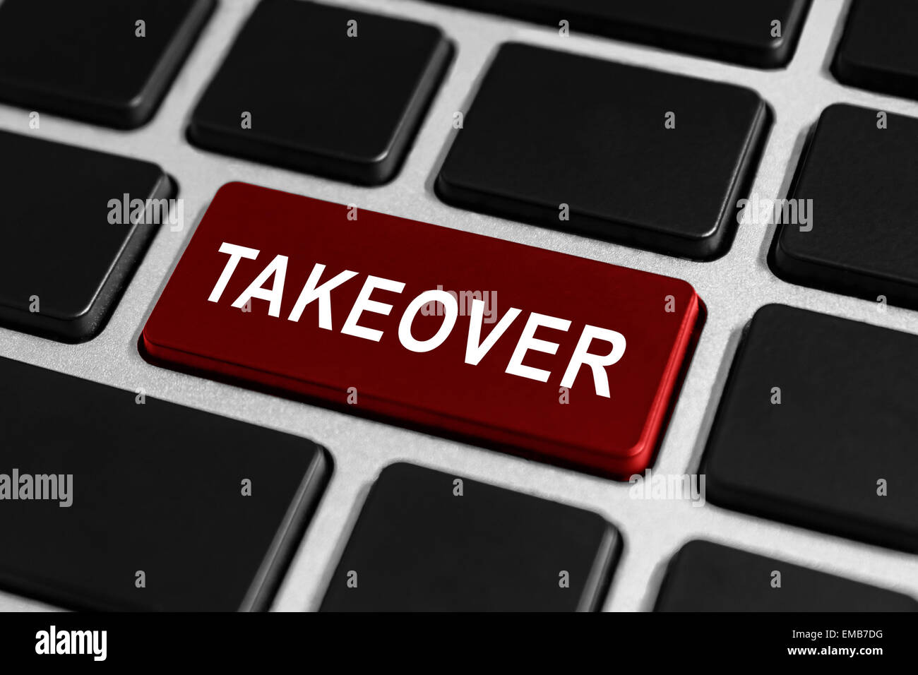 takeover red button on keyboard, business concept Stock Photo