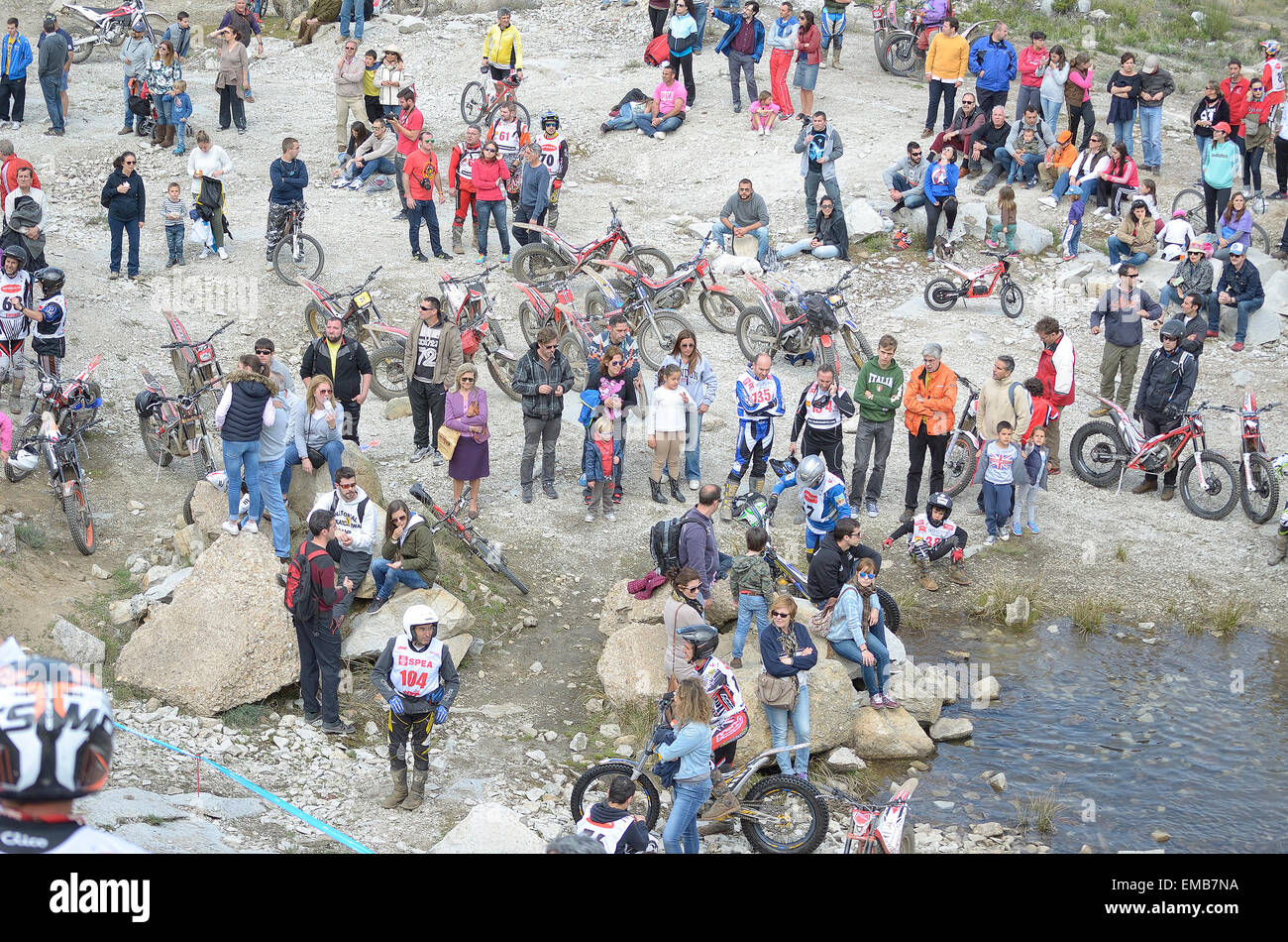 Spain trial championship. Unknown people are waiting at zone where motorcyclists must climb some rocks with their motorcycles. Stock Photo