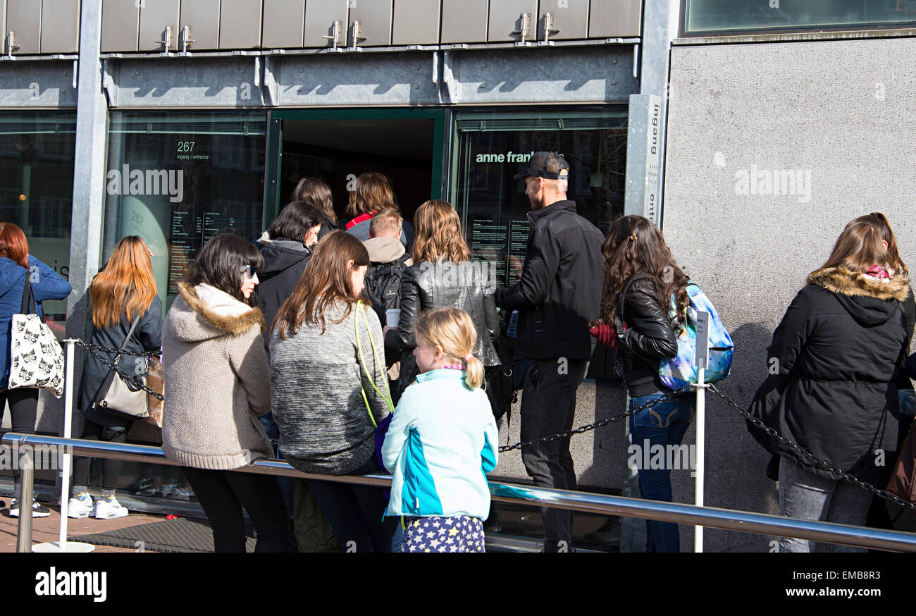 Long queues of visitors wait to go into the historic Anne Frank house. Stock Photo