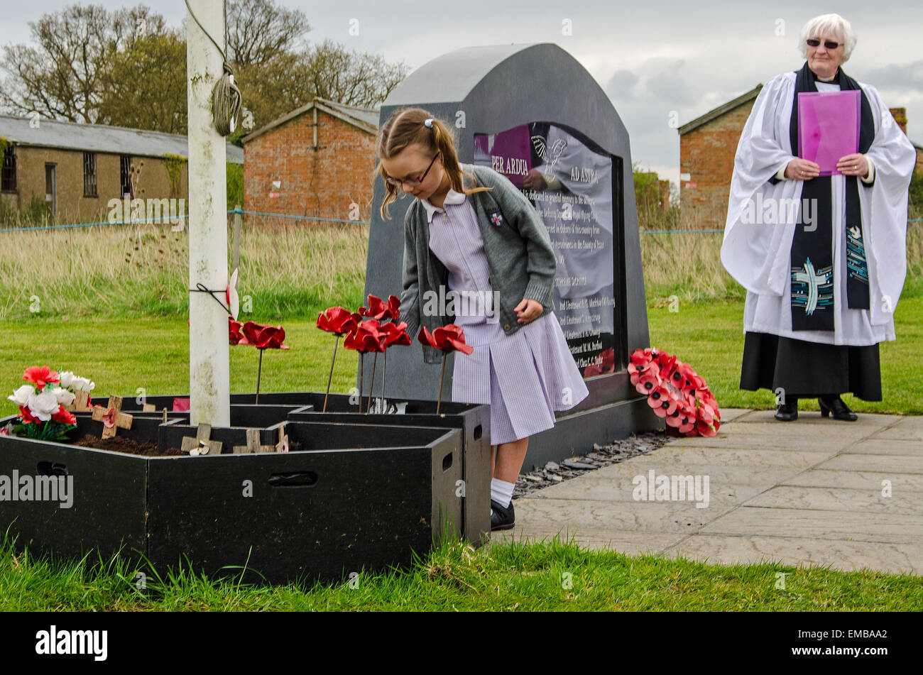 Ten ceramic poppies from the 'Blood Swept Lands and Seas of Red' art installation were 'planted' during a service of remembrance at Stow Maries Aerodrome, in memory of the airmen of 37 (Home Defence) Squadron who died whilst serving the squadron during World War One. Stock Photo