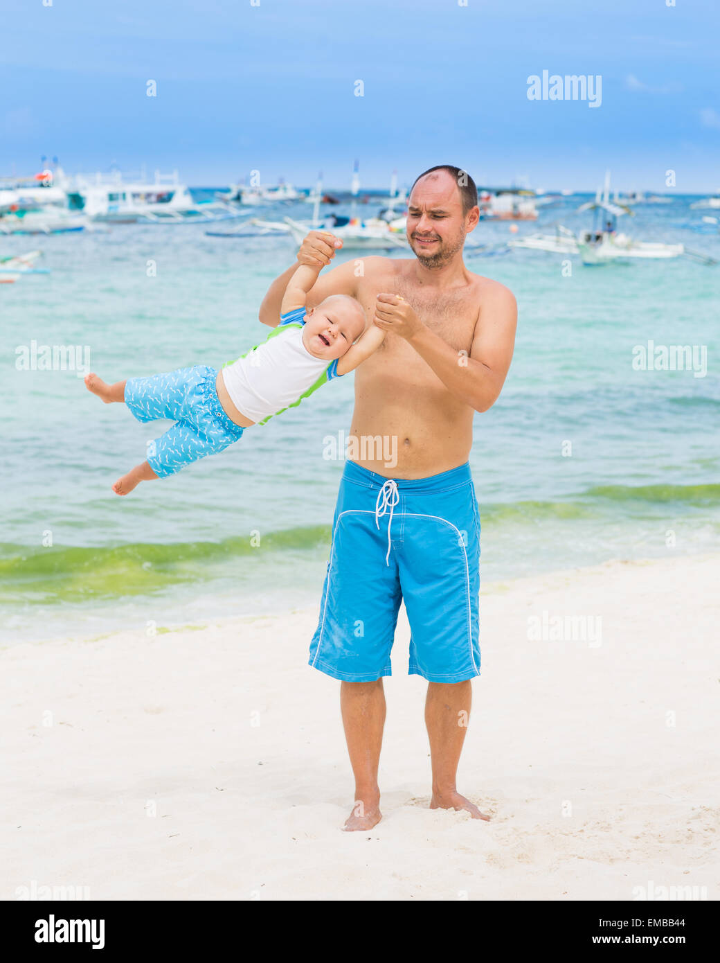 Baby and father on the tropical beach Stock Photo Alamy