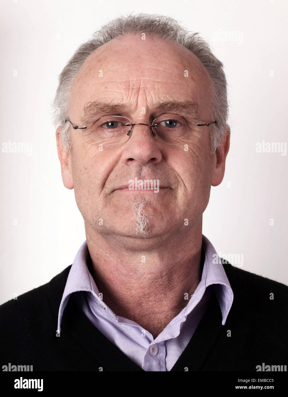 Head shot of mature man, possibly a passport photograph. 30th August 2011 Stock Photo