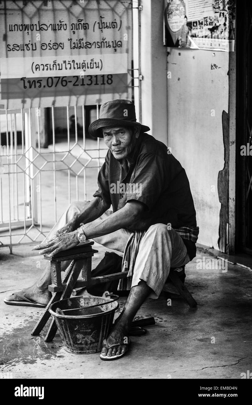 A Thai shopkeeper in Phuket Town, Phuket, Thailand Stock Photo