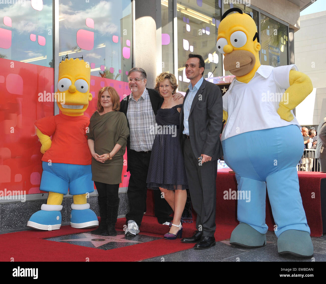 LOS ANGELES, CA - FEBRUARY 14, 2012: 'The Simpsons' creator Matt Groening with Simpsons voice actor Nancy Cartwright (left), Yeardley Smith & Hank Azaria on Hollywood Boulevard where Groening was honored with the 2,459th star on the Hollywood Walk of Fame. February 14, 2012 Los Angeles, CA Stock Photo