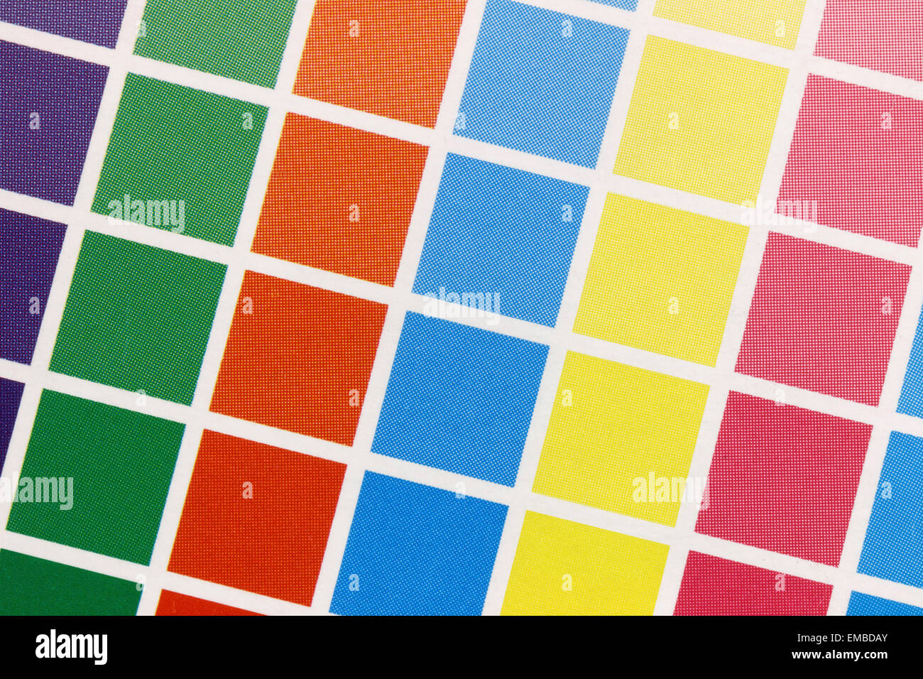 Close-up of a a cmyk test print with many color squares from above Stock Photo