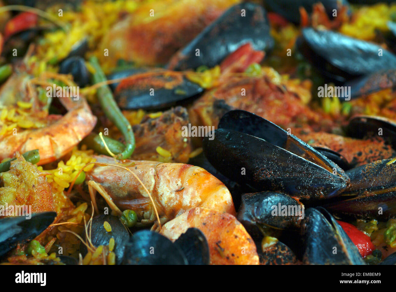 Ready cooked meal of mussels and shrimps on a market stand in Provence France Stock Photo