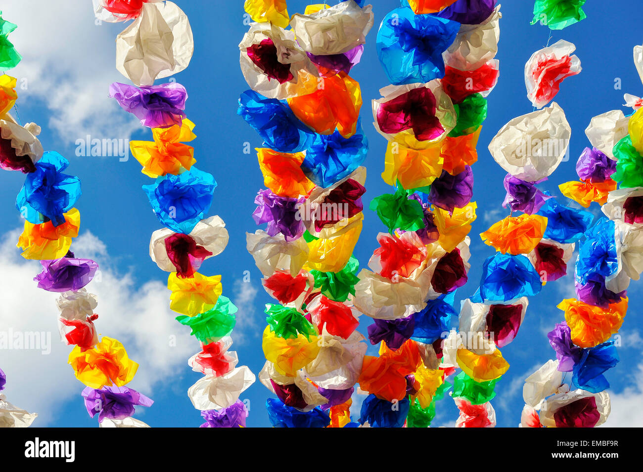 Colorful paper decoration garland on a market place Stock Photo